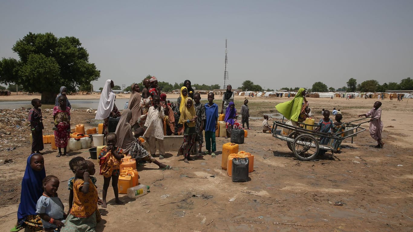 June 28 2017 Maiduguri Borno State Nigeria Displaced people collect water in Muna Garage IDP