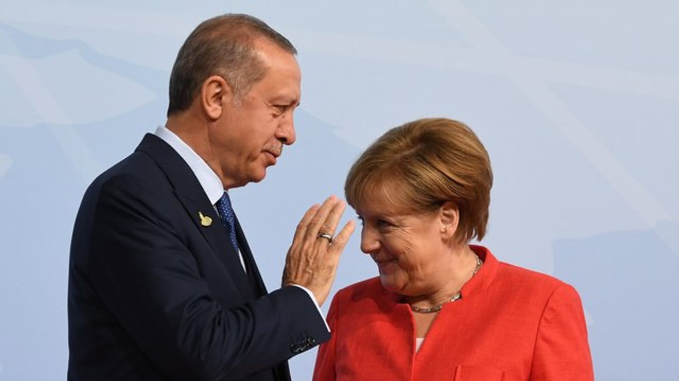 Bundeskanzlerin Merkel begrüßt den türkischen Präsidenten Erdogan beim G20-Gipfel.