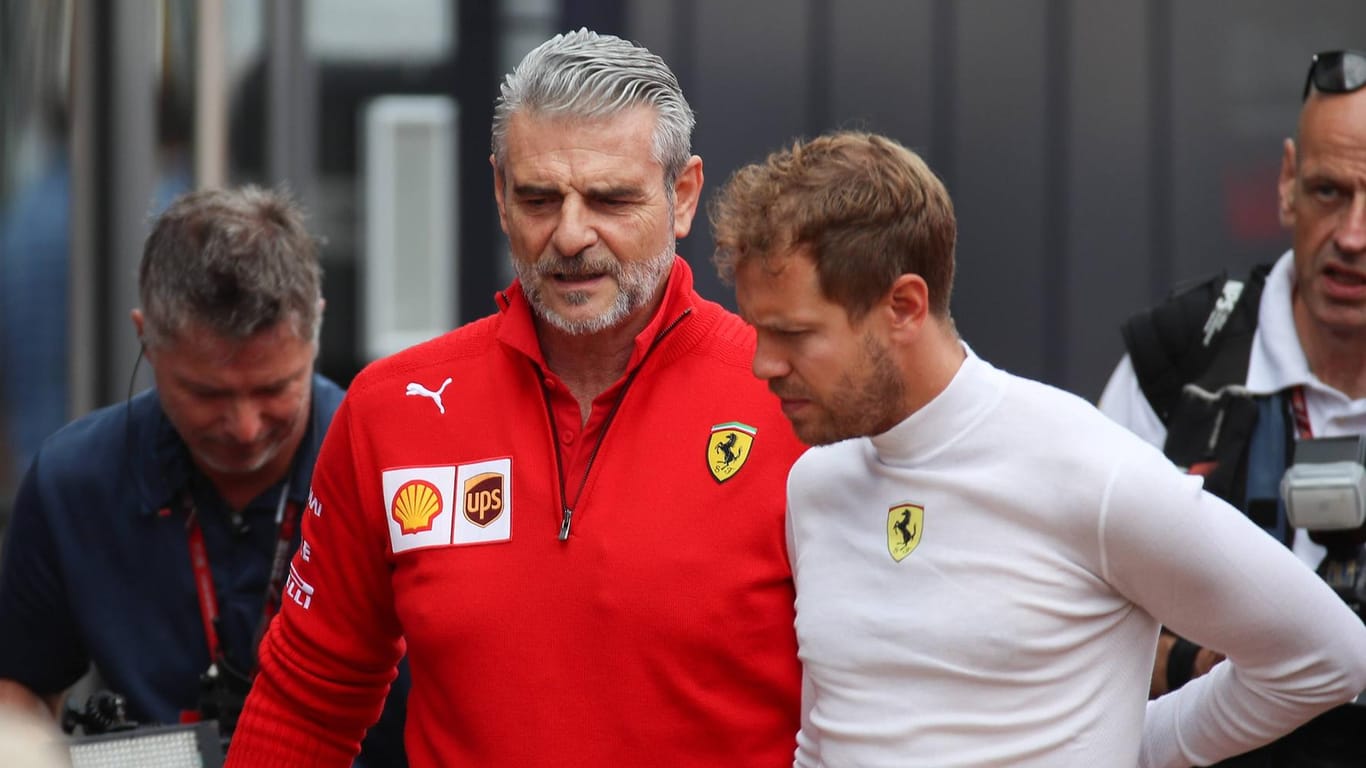 Der Chef und sein Star: Ferrari-Teamchef Maurizio Arrivabene (l.) neben Sebastian Vettel.