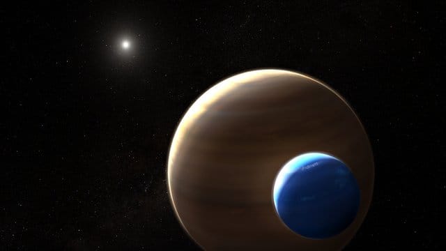 Die Illustration zeigt den Planeten Keppler-1625b und seinen Mond. Die Illustration zeigt den Planeten Keppler-1625b und seinen Mond.