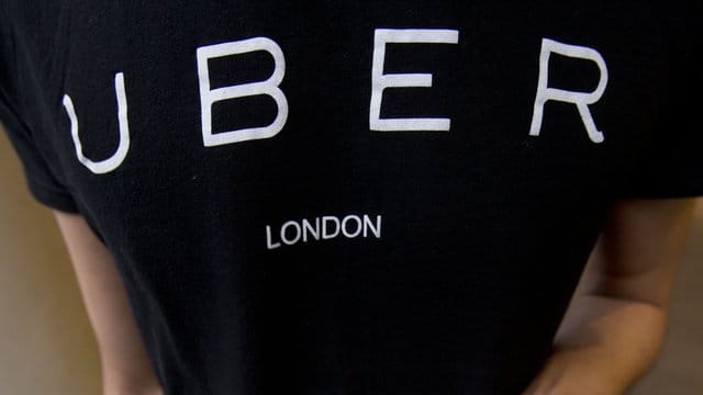 Die "Uber"-App auf einem Smartphone. Die "Uber"-App auf einem Smartphone.