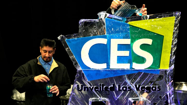 FILE PHOTO: Bartenders pour blue cocktails through an ice sculpture at CES in Las Vegas