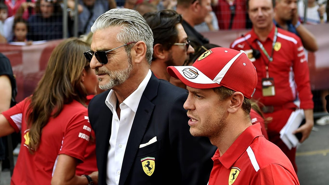 Sebastian Vettel (rechts) und Maurizio Arrivabene.