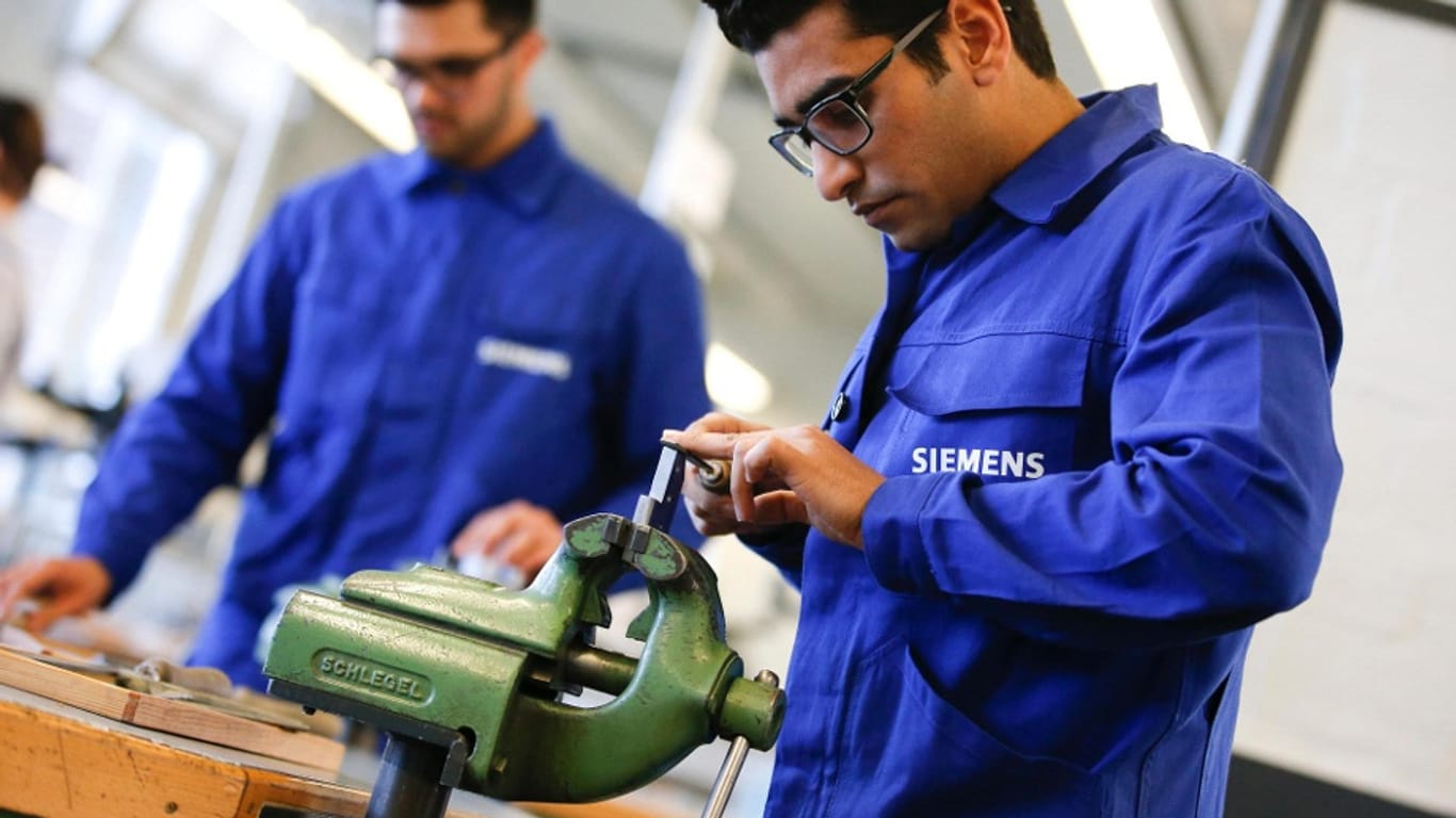 Bei Siemens angestellte Flüchtlinge.