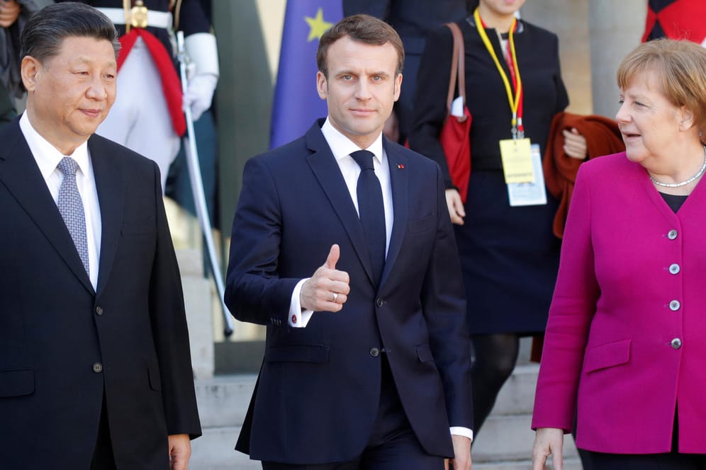 Gipfeltreffen in Paris (v. l.): Chinas Staatschef Xi Jinping, Frankreichs Präsident Emmanuel Macron und Bundeskanzlerin Angela Merkel.
