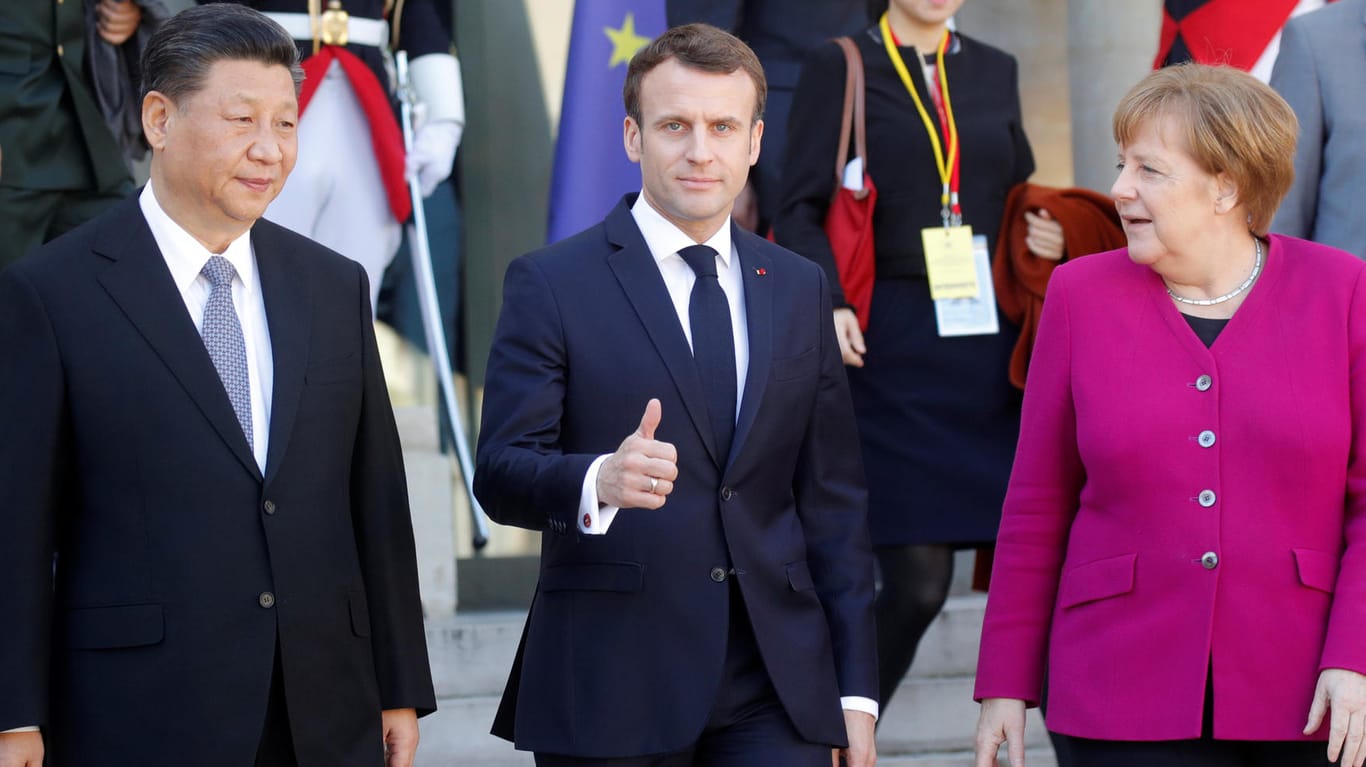 Gipfeltreffen in Paris (v. l.): Chinas Staatschef Xi Jinping, Frankreichs Präsident Emmanuel Macron und Bundeskanzlerin Angela Merkel.