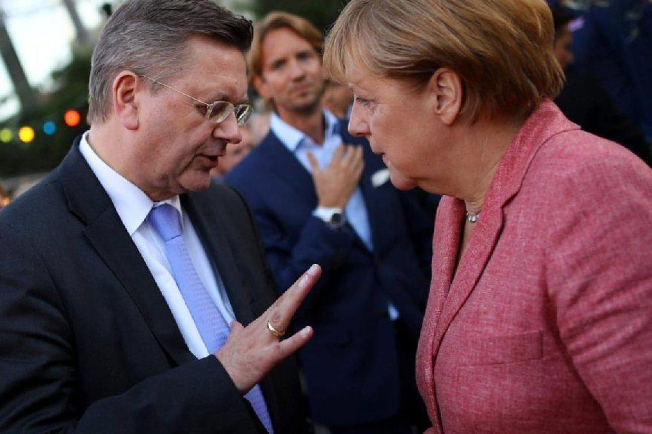 Reinhard Grindel, Angela Merkel.