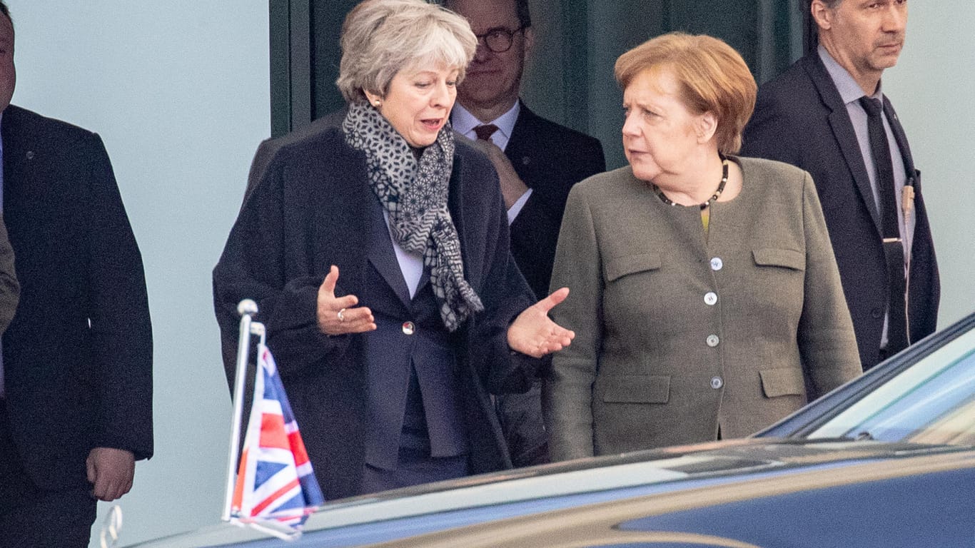 Theresa May, Angela Merkel.