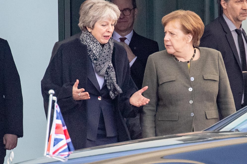 Theresa May, Angela Merkel.