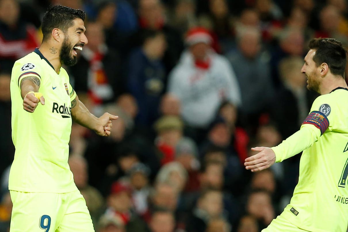 Jubel bei Luis Suarez (l.) und Lionel Messi: Der FC Barcelona siegte bei Manchester United.