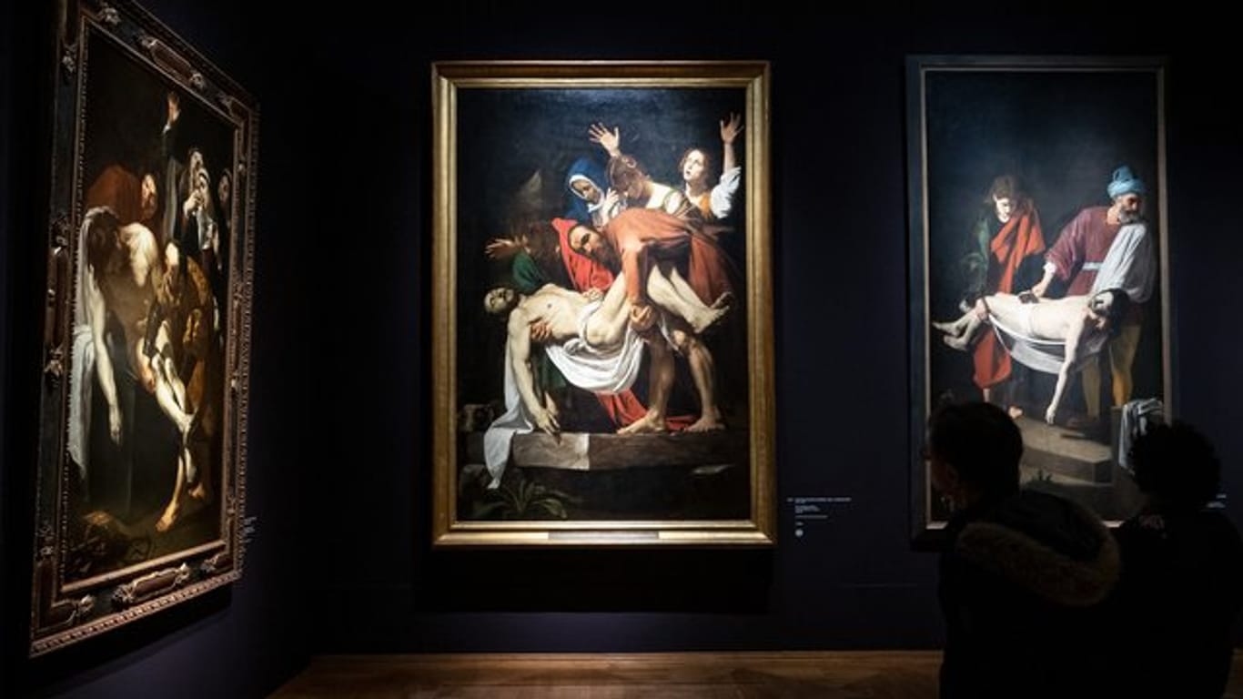 "Die Grablegung Christi" von Dirk van Baburen (r) und Caravaggio (Mitte) und Nicolas Tournier (l) in München.