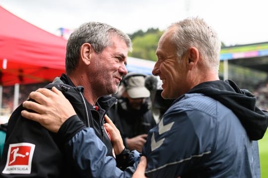 Glücklich mit ihren Teams: Düsseldorf-Coach Funkel und Freiburgs Trainer Streich.