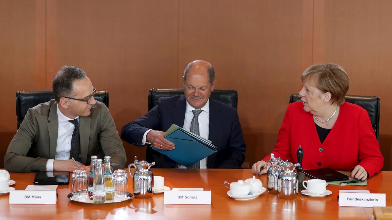 Heiko Maas, Olaf Scholz und Angela Merkel: In der Groko wird nun um das Geld für Prestigeprojekte gefeilscht.