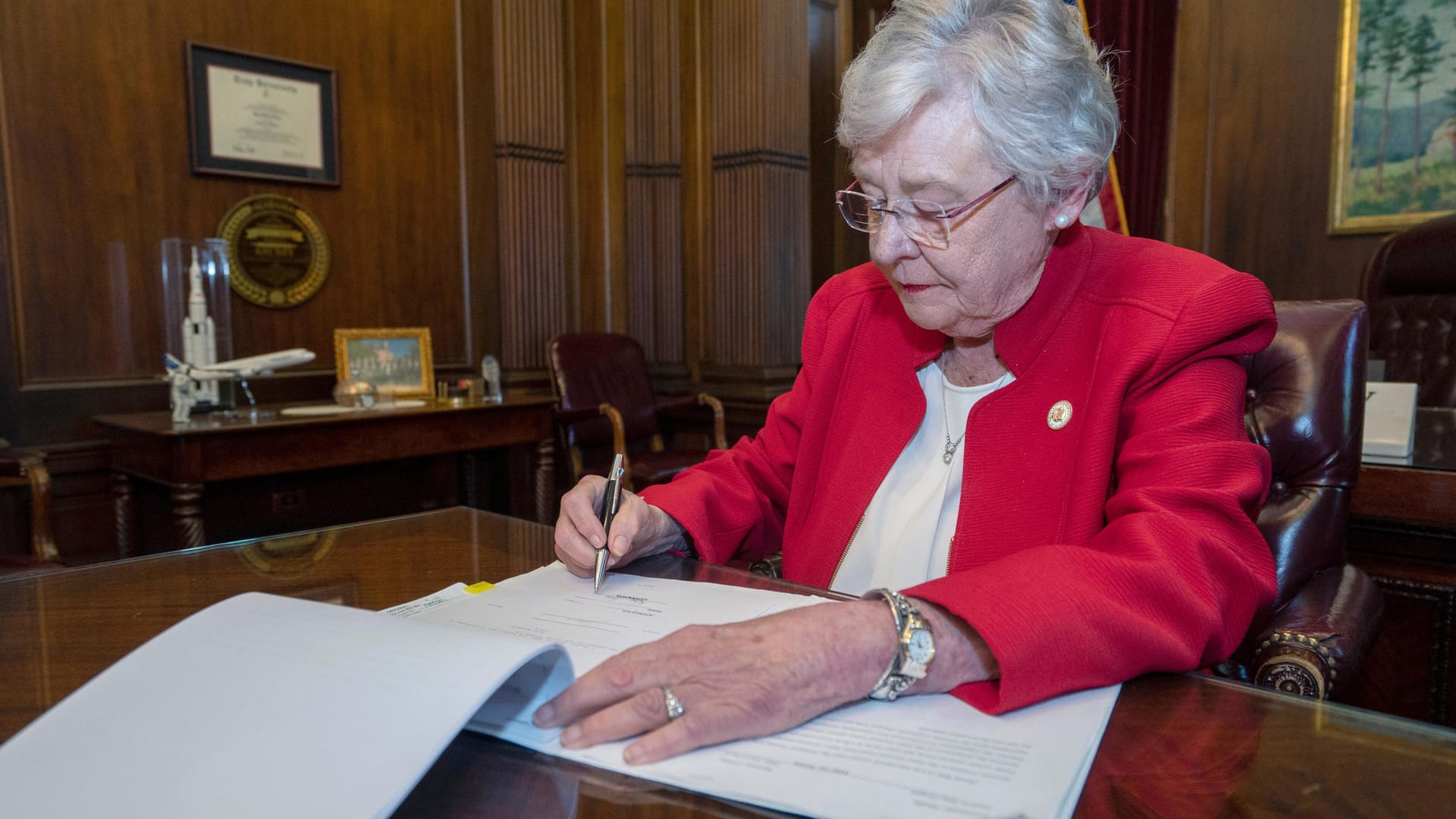 Handout photo of Alabama Governor Kay Ivey signing into law the Alabama Human Life Protection Act in Montgomery