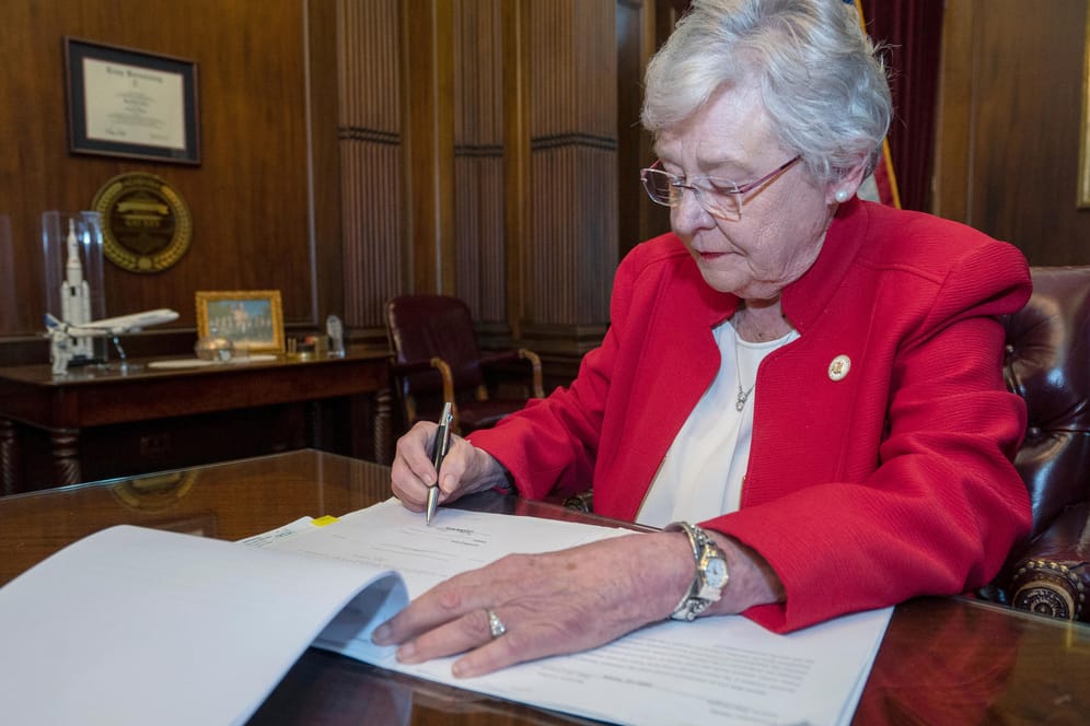 Handout photo of Alabama Governor Kay Ivey signing into law the Alabama Human Life Protection Act in Montgomery