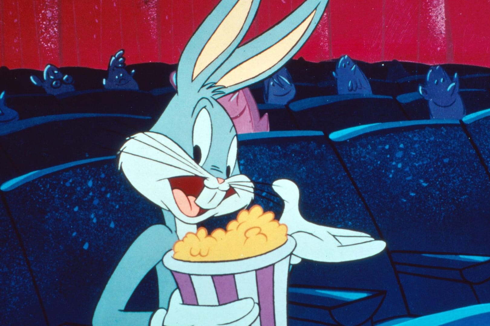 Bugs Bunny genießt Popcorn: Testen Sie in diesem Quiz Ihr Wissen über Zeichentrickfiguren.