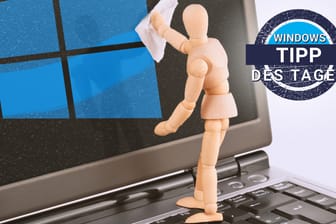 Eine Puppe säubert den Bildschirm eines Windows-Rechners: Mithilfe der Speicheroptimierung löscht Windows automatisch Daten.