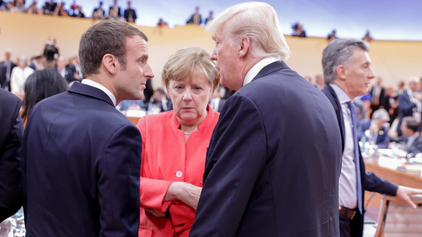 Donald Trump, Angela Merkel und Emmanuel Macron: Auf dem Kongress in Bonn soll die nächste Klimakonferenz vorbereitet werden – durch die Haltung der USA könnte das schwierig werden.