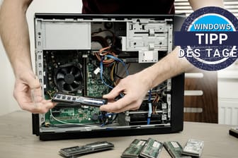 Ein Mann baut PC-Komponenten ein: Beim Kauf von Hardware im Internet ist Vorsicht geboten. Betrüger bieten gefälschte Billigware an.
