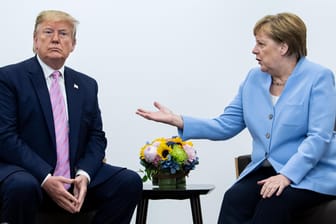 Donald Trump und Angela Merkel: Der US-Präsident ist nicht mehr der Einzige, der in Klima-Fragen auf die Bremse tritt. Die Abschlusserklärung des G20-Gipfels in Osaka steht auf der Kippe.