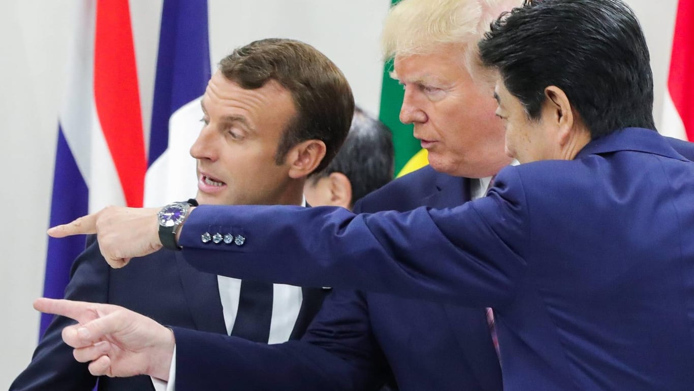 Frankreichs Präsident Emmanuel Macron, US-Präsident Donald Trump and Japans Premierminister Shinzo Abe: Sie konnten sich in Osaka nicht auf eine gemeinsame Richtung beim Klimaschutz einigen.