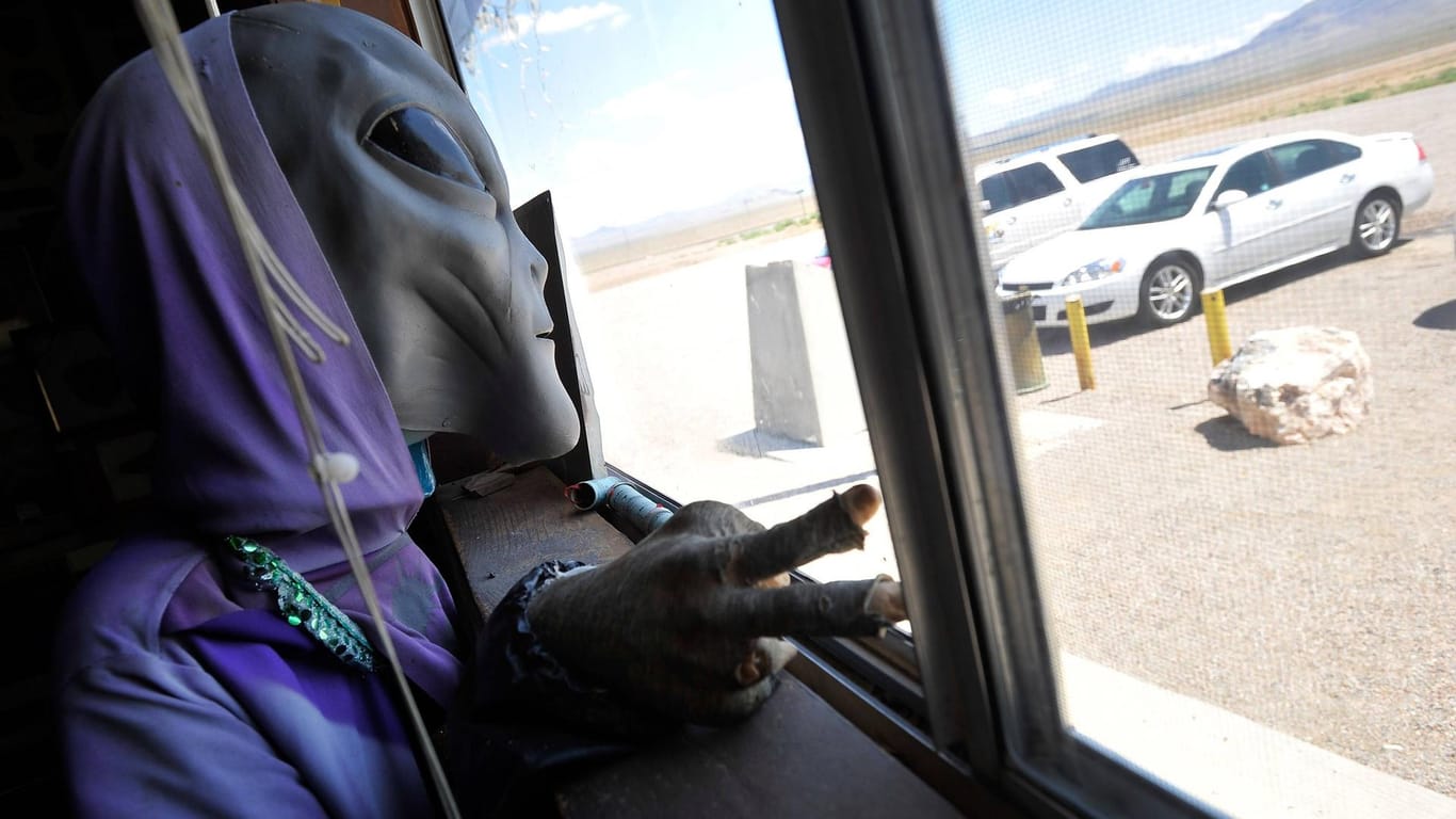 August 5 2014 Rachel Nevada U S A masked figure representing an alien greets patrons at the
