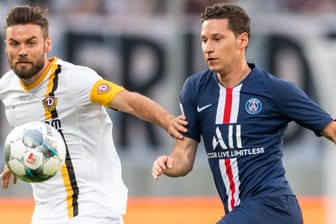 Dynamos Niklas Kreuzer (li) gegen den Pariser Julian Draxler.