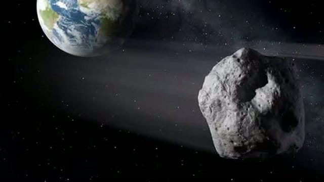 Die künstlerische Darstellung zeigt einen erdnahen Asteroiden im Vorbeiflug der Erde. Die künstlerische Darstellung zeigt einen erdnahen Asteroiden im Vorbeiflug der Erde.