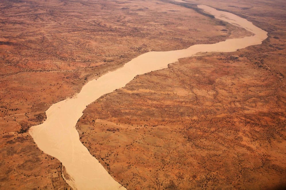 A dried up river filled with sand winds its way across the desert near Gos Beida in eastern Chad