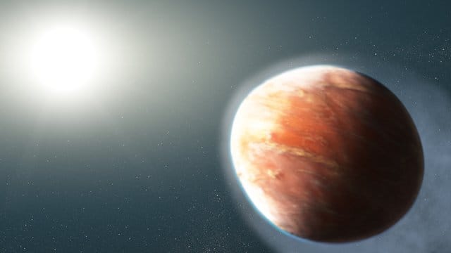 Die grafische Darstellung zeigt den Planeten, der wie ein American Football geformt sein soll und Metalle ins All schleudert.