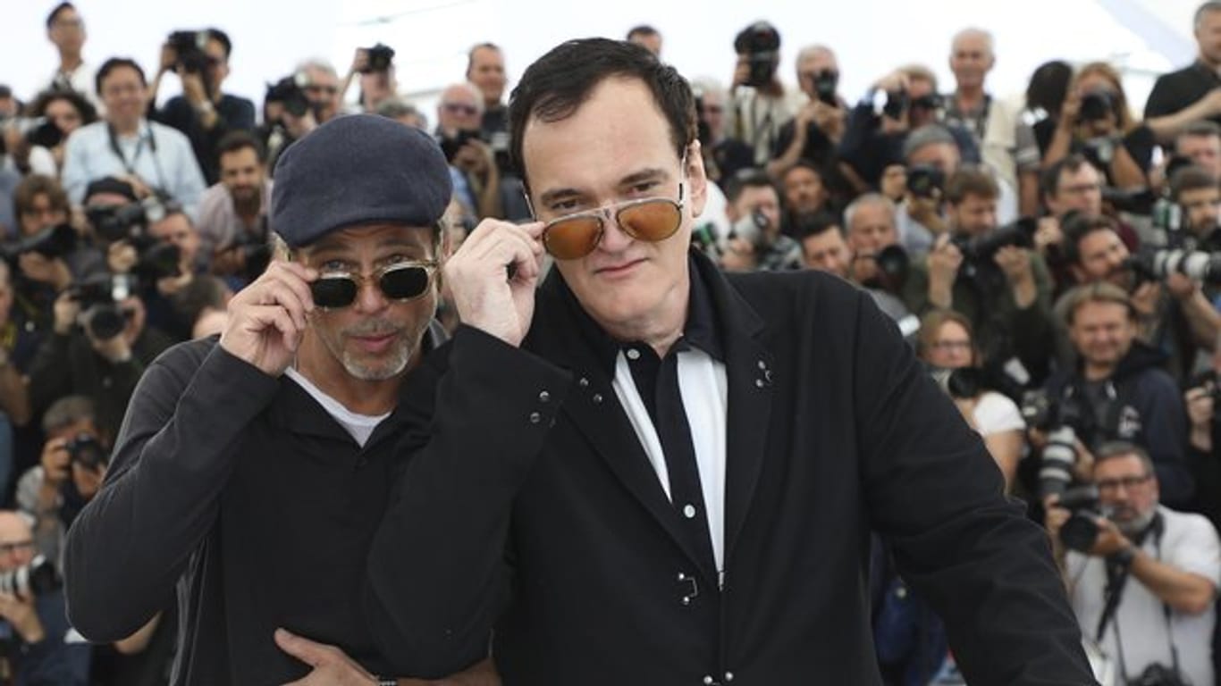 Brad Pitt (l), Schauspieler aus den USA, und Quentin Tarantino (r), Regisseur aus den USA, werbenfür ihren neuen Film.