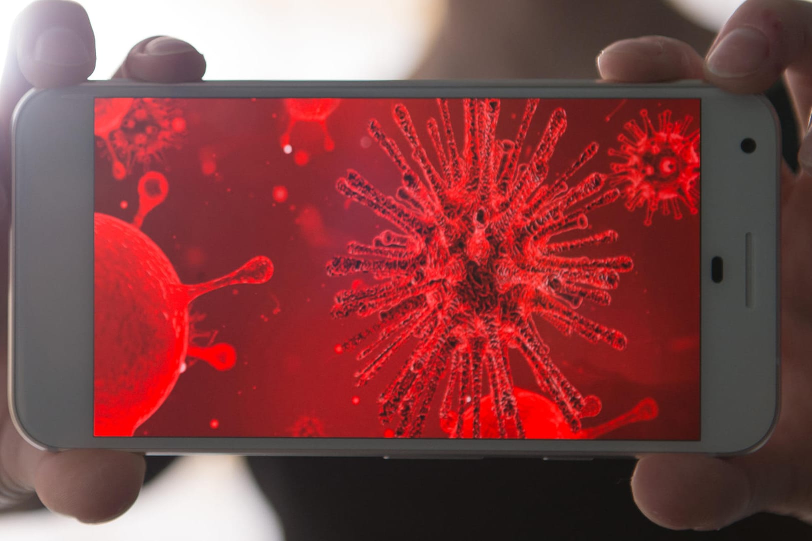 Eine symbolische Darstellung von Schadsoftware auf einem Smartphone: Google hat 85 betrügerische Apps aus dem Play Store entfernt.