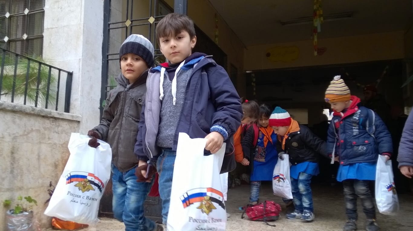 Russian soldiers bring presents to schoolchildren in Aleppo, Syri