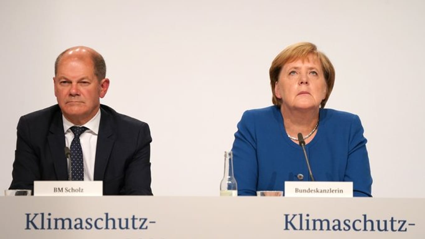 Kanzlerin Angela Merkel (CDU) und Finanzminister Olaf Scholz (SPD) nach der Sitzung des Klimakabinetts.