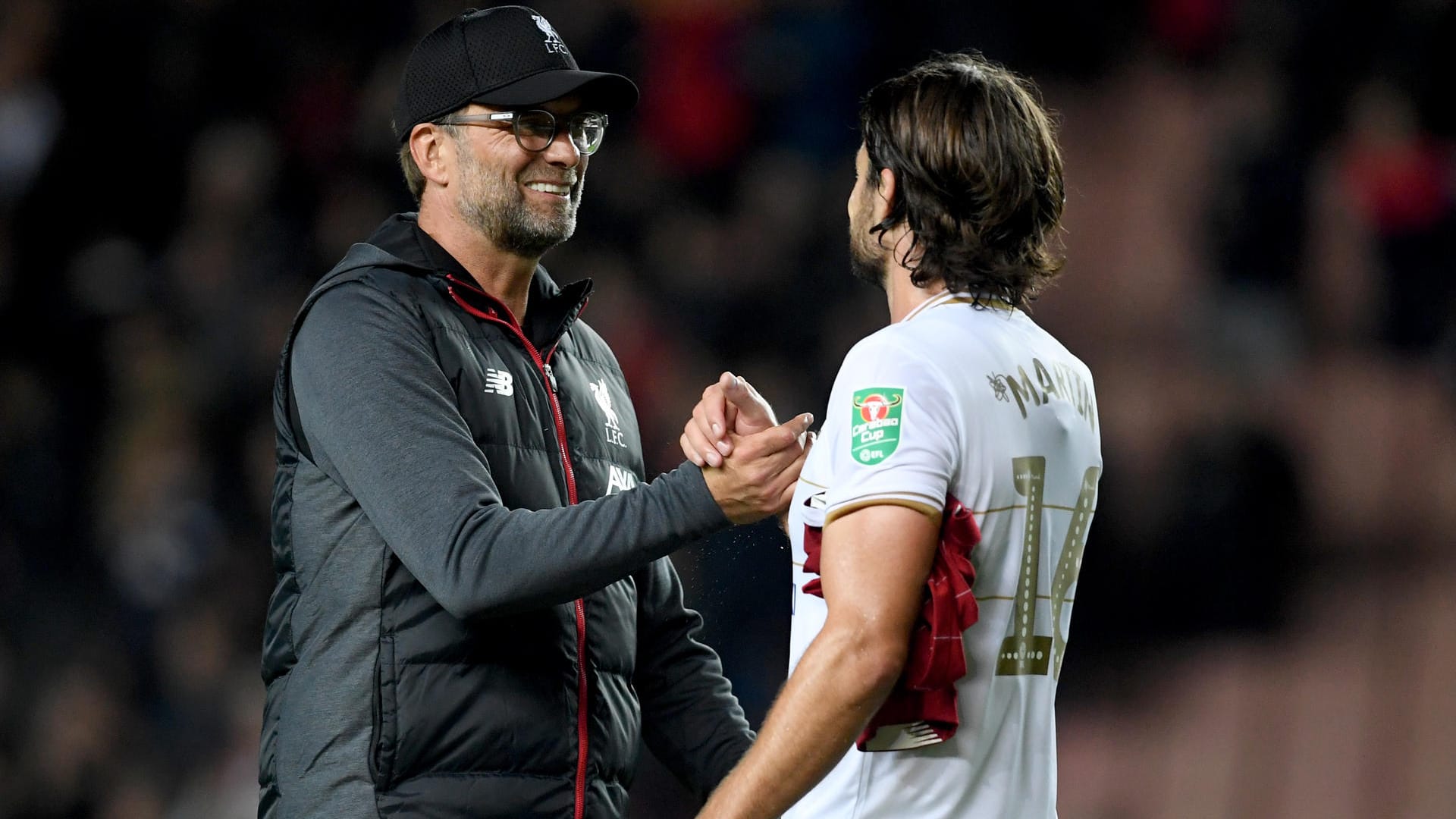 Erleichtert: Liverpool-Trainer Jürgen Klopp nach der Partie mit Russell Martin von Milton Keynes.