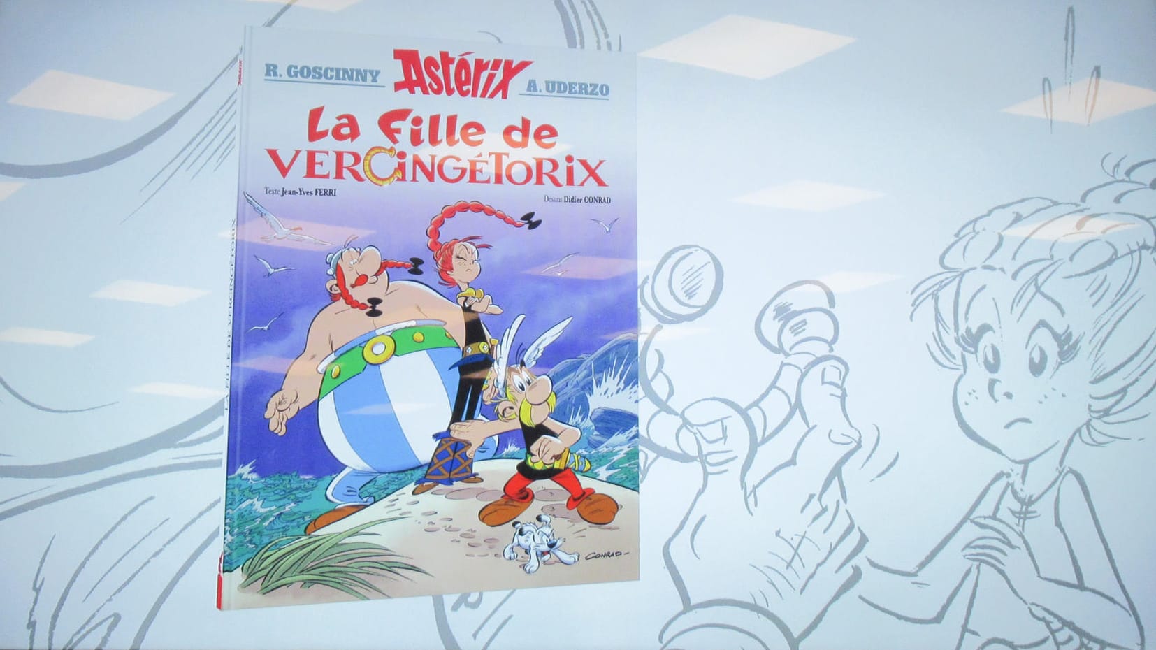 Neues Asterix-Heft auf einer Videoleinwand: Die Heldin der Geschichte ist die selbstbewusste Adrenaline.