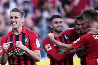 Nils Petersen (l) und der SC Freiburg sorgt in der Bundesliga für Furore.