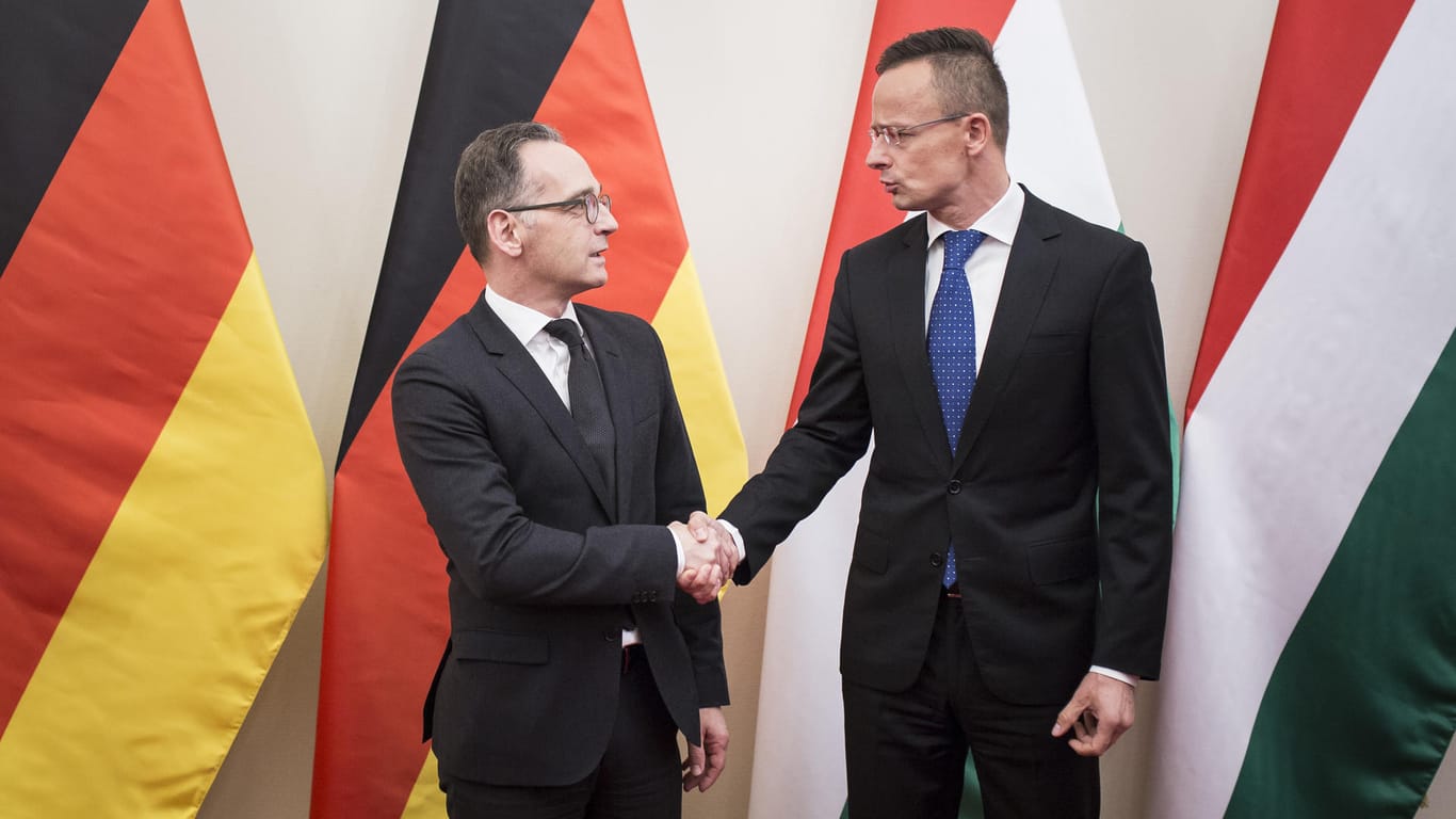 Außenminister Heiko Maas (links) und der ungarische Außenminister Peter Szijjarto: Das deutsch-ungarische Verhältnis hat sich deutlich abgekühlt.