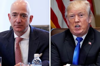 Die Bildkombination zeigt Amazon-Chef Jeff Bezos und US-Präsident Donald Trump: Amazon wirft der Trump-Regierung vor, den Konkurrenten Microsoft aus politischen Gründen zu begünstigen.