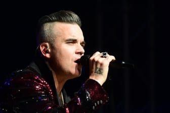 Robbie Williams will im nächsten Jahr ein Benefizkonzert geben.