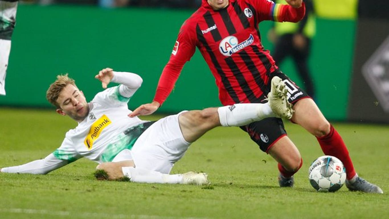 Christoph Kramer (l) bleibt Borussia Mönchengladbach erhalten.