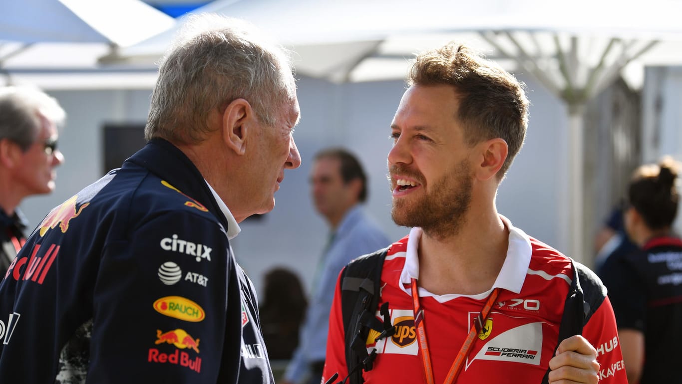 Früher gemeinsam bei Red Bull, heute Konkurrenten: Red-Bull-Motorsport-Chef Helmut Marko (l.) und Ferrari-Fahrer Sebastian Vettel (r.).