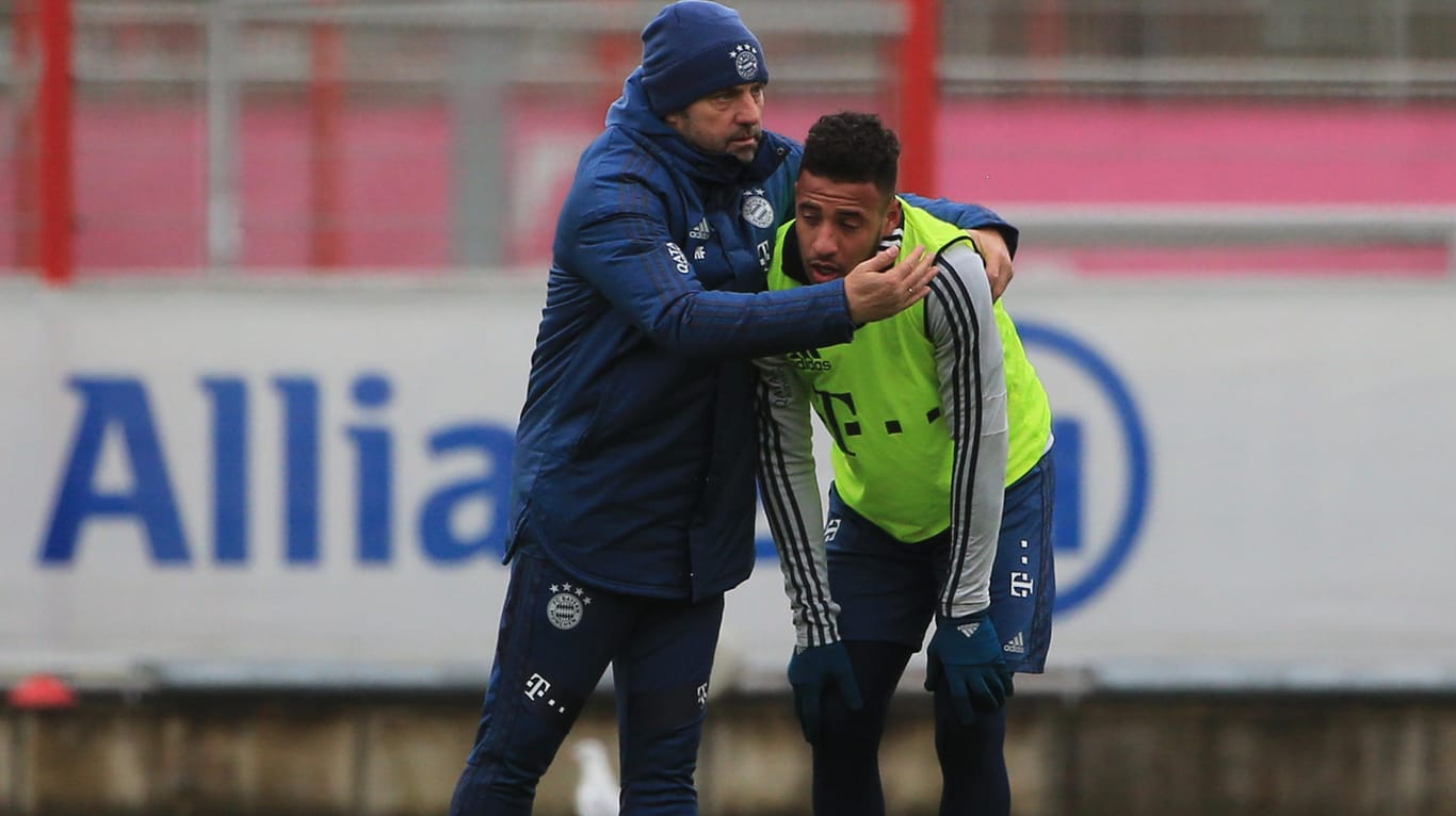 Angeschlagen: Corentin Tolisso (r.) im Bayern-Training mit Trainer Hansi Flick.