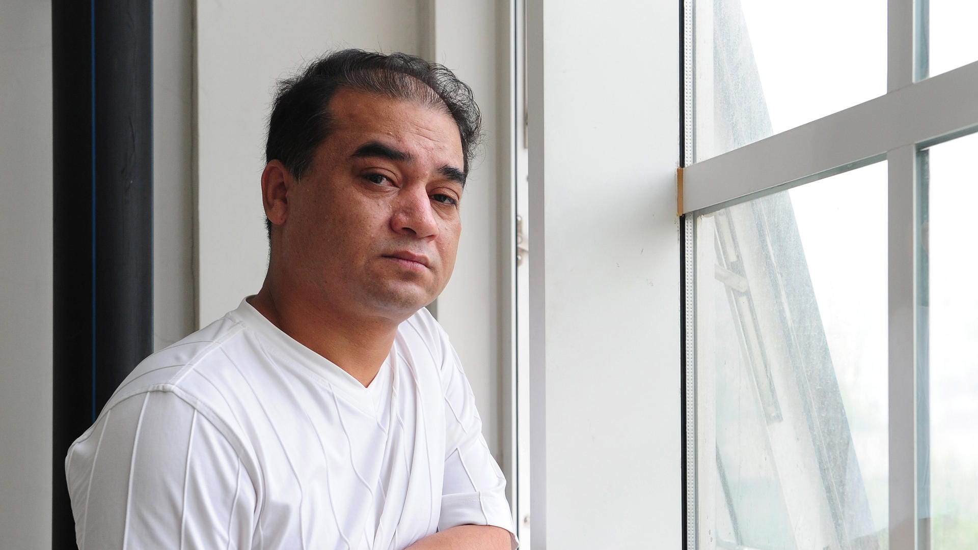 Der uigurische Wissenschaftler Ilham Tohti in einer Aufnahme vor neun Jahren. Aktuelle Fotos von ihm gibt es nicht, da die Chinesen ihn gefangen halten.