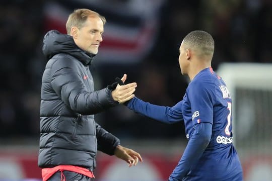 Stehen mit PSG im Ligapokal-Viertelfinale: Coach Thomas Tuckel (l) und Kylian Mbappe.
