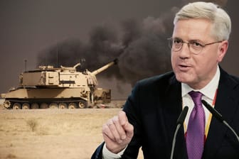 Norbert Röttgen und ein Panzer der US-Armee bei der Bekämpfung des IS (Symbolbild).