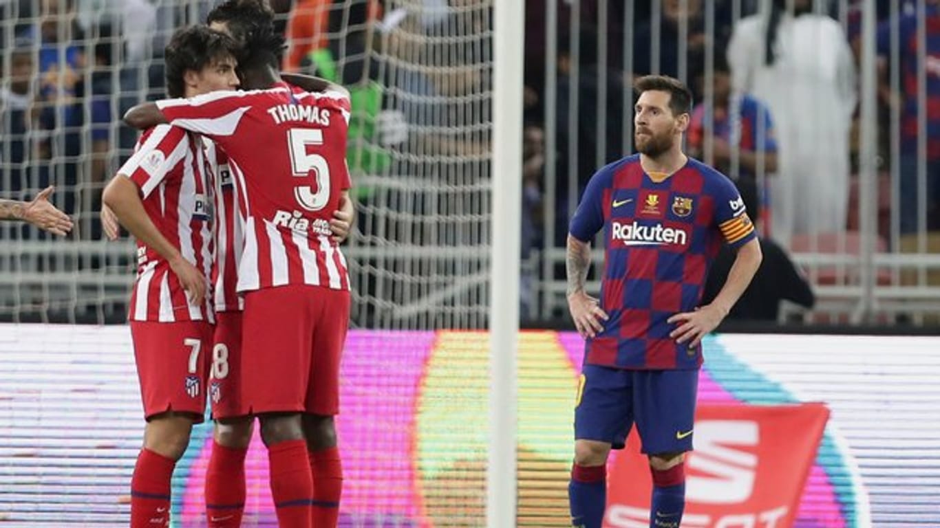 Bedient: Lionel Messi (r) nach der Barca-Pleite gegen Atlético.