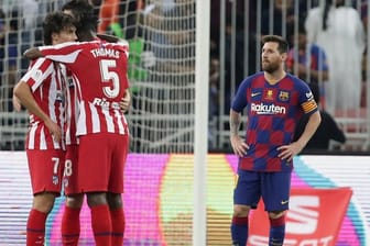 Bedient: Lionel Messi (r) nach der Barca-Pleite gegen Atlético.