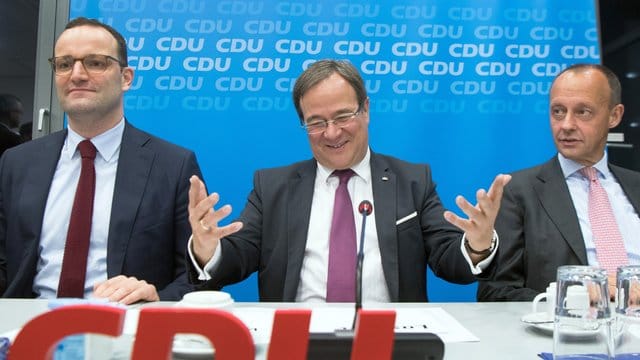 Gesundheitsminister Jens Spahn (l-r), NRW-Ministerpräsident Armin Laschet und Friedrich Merz. Gesundheitsminister Jens Spahn (l-r), NRW-Ministerpräsident Armin Laschet und Friedrich Merz.