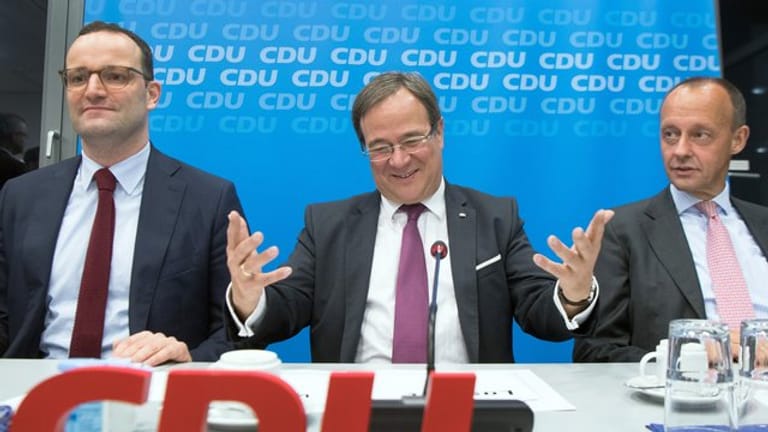 Gesundheitsminister Jens Spahn (l-r), NRW-Ministerpräsident Armin Laschet und Friedrich Merz.